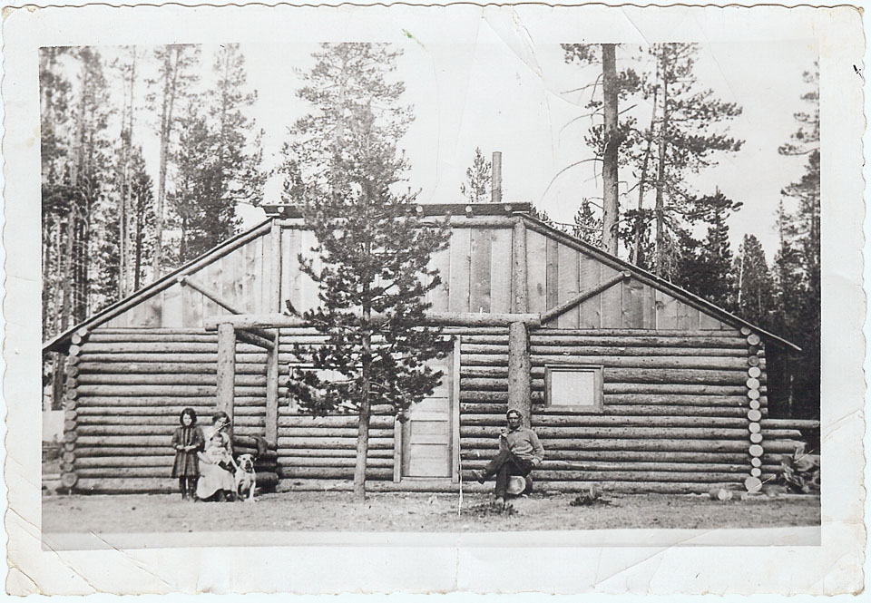 'The first half of the Collins house on homestead.  Dr & Mrs H C Collins & children Leah & John & 'Guess' Col Sandy Macnab's bulldog.  Taken by Sandy Macnab brother of Mrs Collins.'