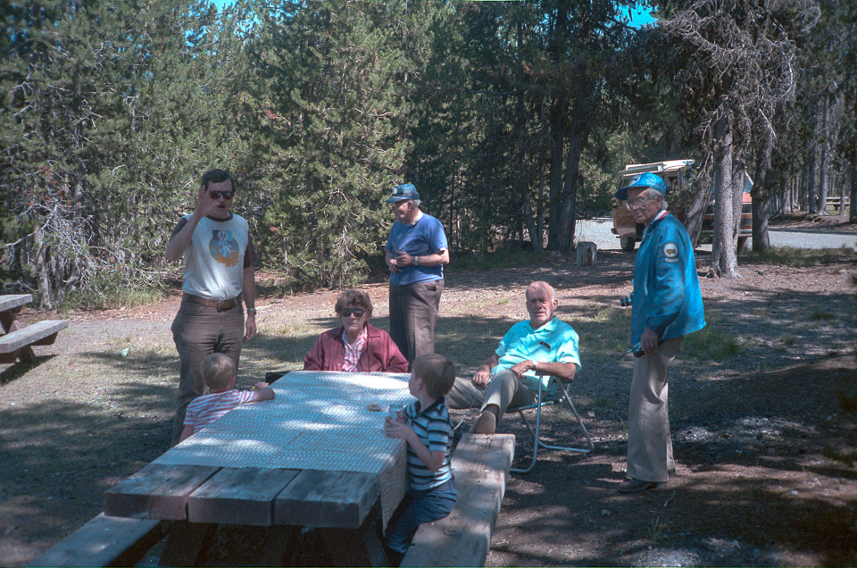 Brian, Doug, Mom, Bob Gray, Jeff, Doug Murray, and Dad picnicing at Diamond Lake.  Our Vanagon camper is in the background.