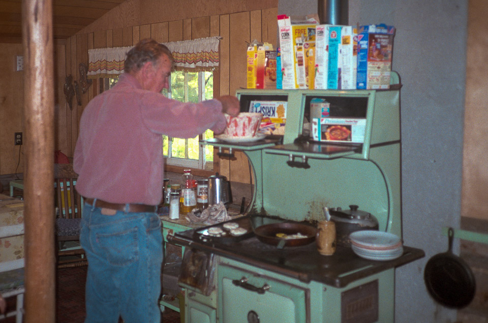 At Leah & Don's: Don cooking his famous pancakes on the wood stove