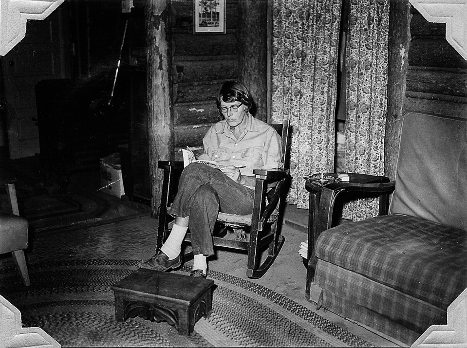 Mom in her rocking chair doing a crossword puzzle, one of her favorite pastimes.