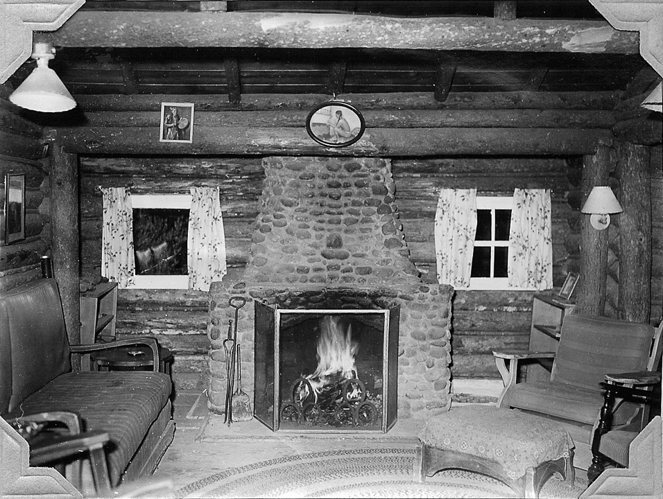 The Living Room at the Ranch with a fire in the fireplace