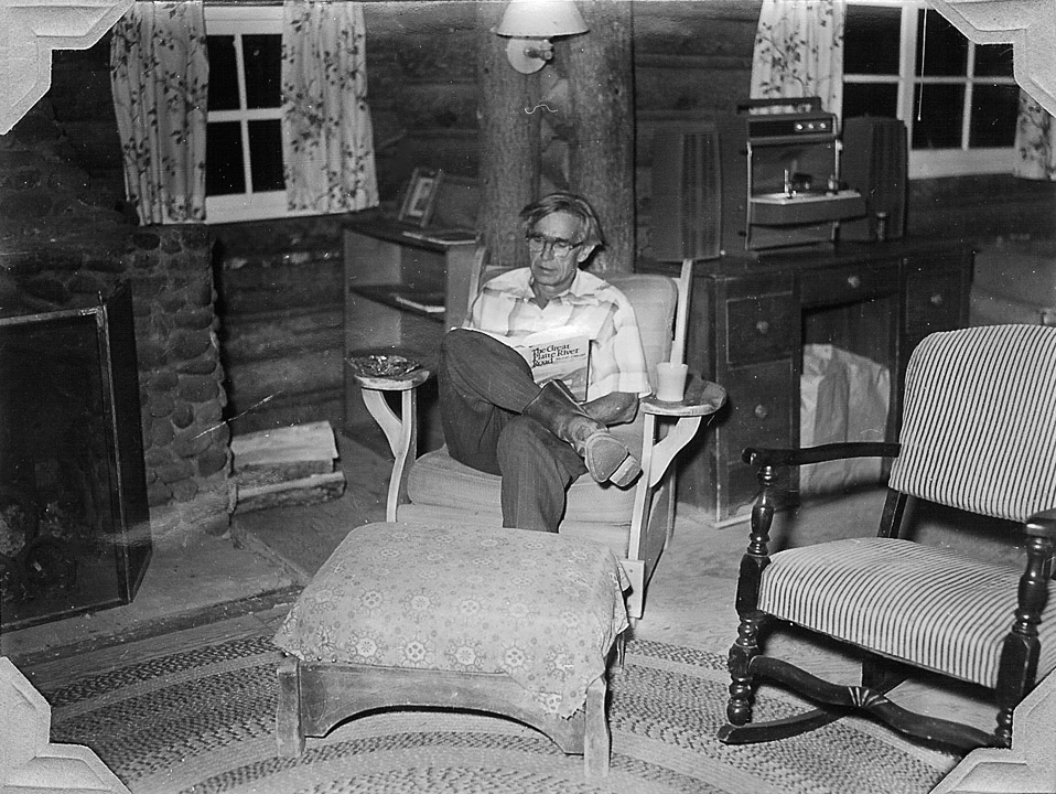 Dad relaxing with a western history book ('The Great Platte River Road') in the Living Room at the Ranch.  Western history was one of his passions.