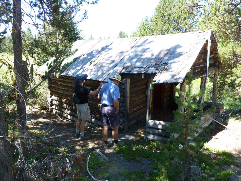 Rick and George Jensen explore the 'Old Pump House'.  Rick remembered helping Doug with replacement roofing.
Photo provided by Lynne Jensen